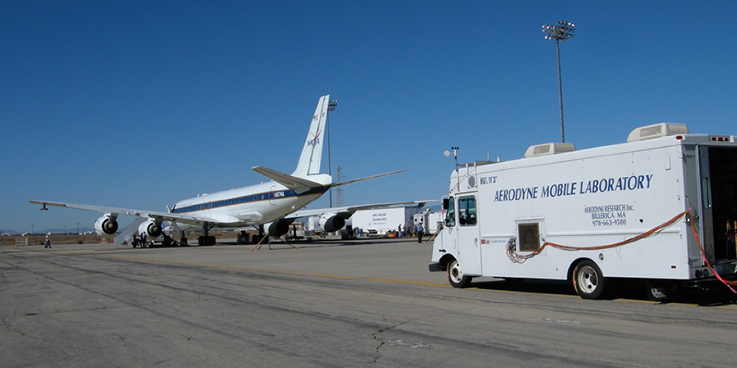 mobile laboratory van with airplane in background