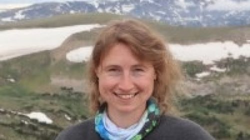 Woman standing in front of mountains