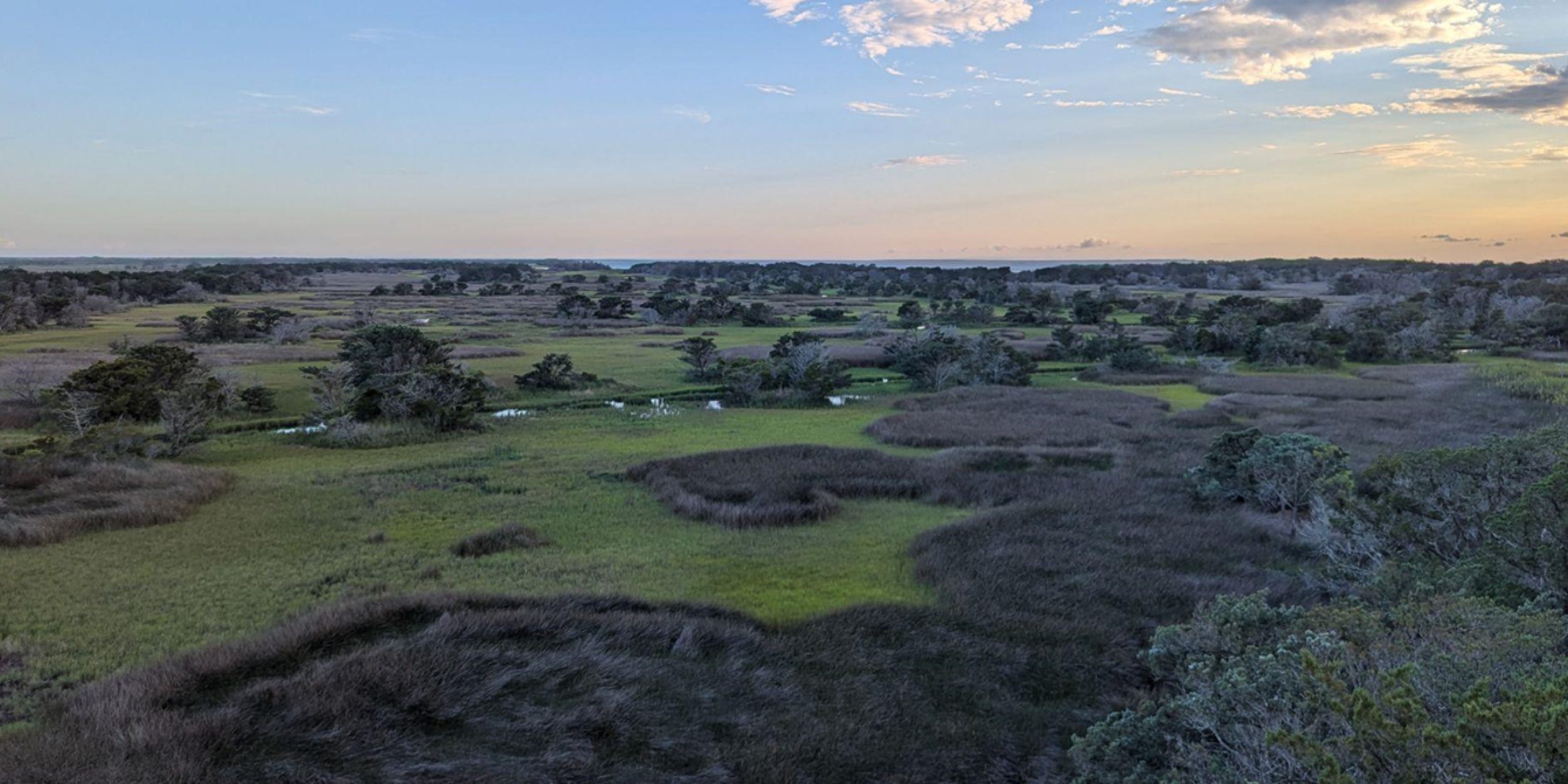 View overlooking Ocracoke Island wetlands as the sun is setting.